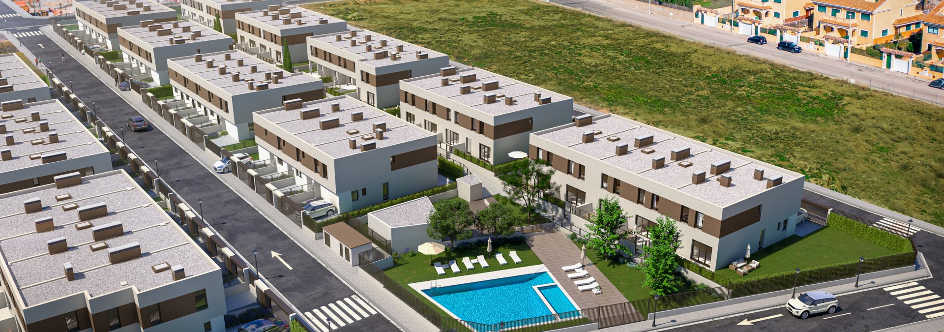 Vista área viviendas unifamiliares con piscina comunitaria en Rocafort