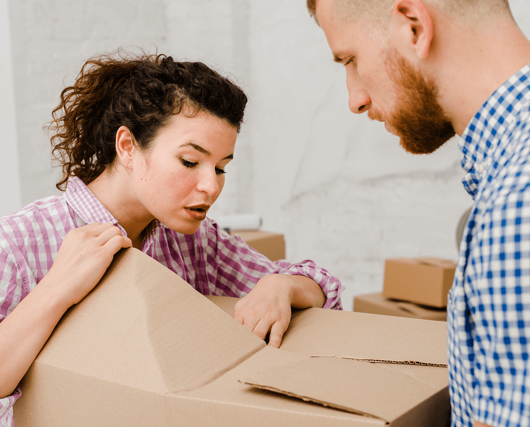 couple inspecting things box 1
