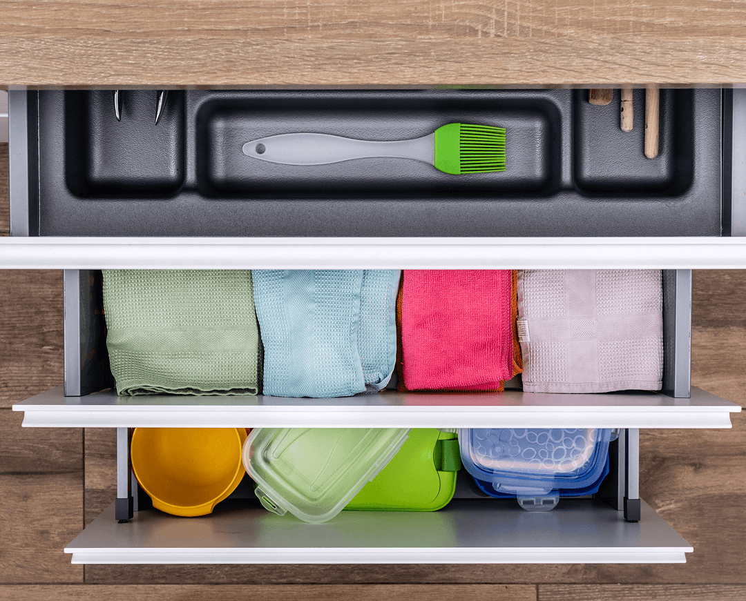 drawer with cutlery kitchen towels lunch boxes 1