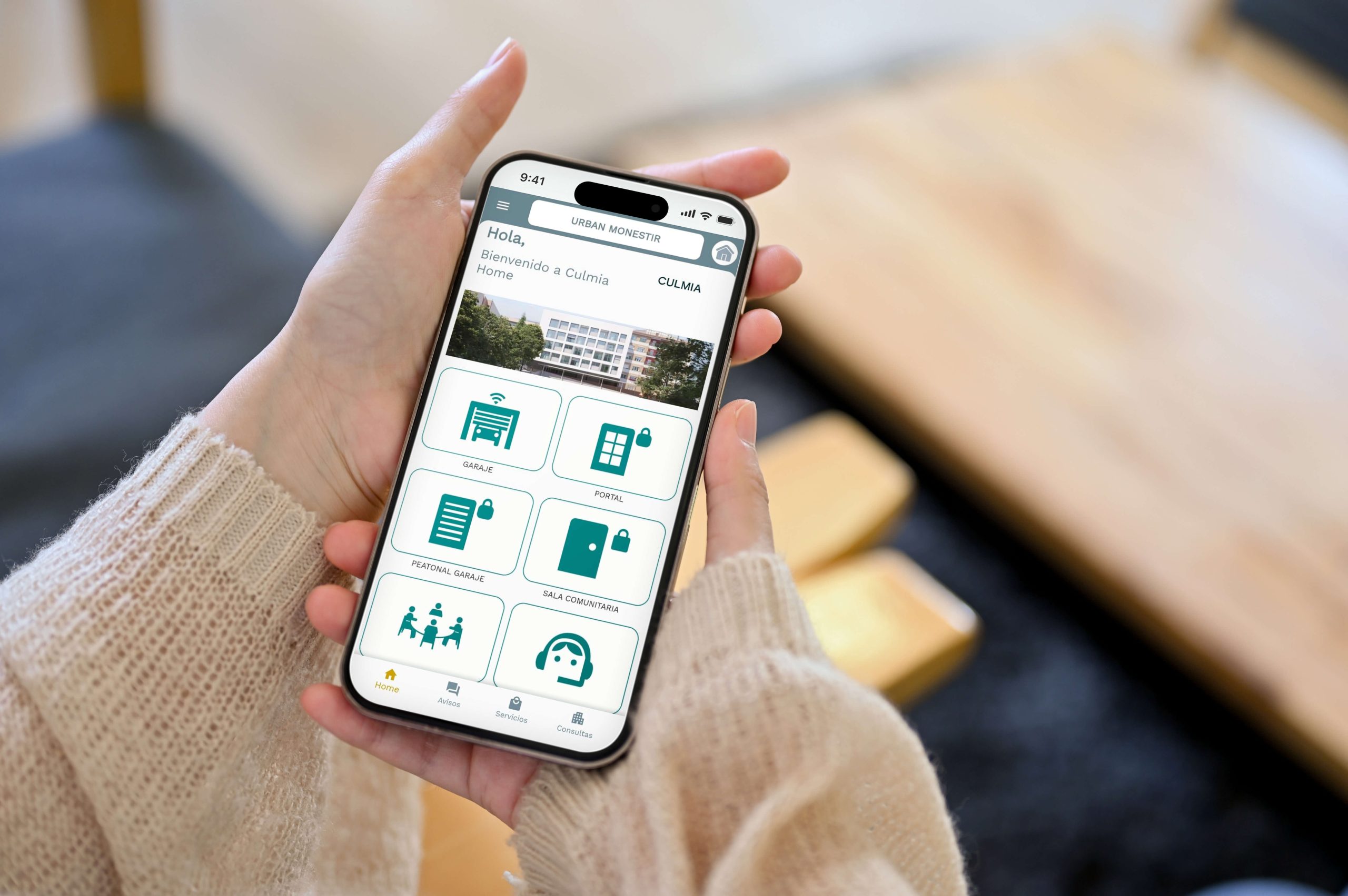 Person holding cell phone with blank screen, representing technology or real estate application.