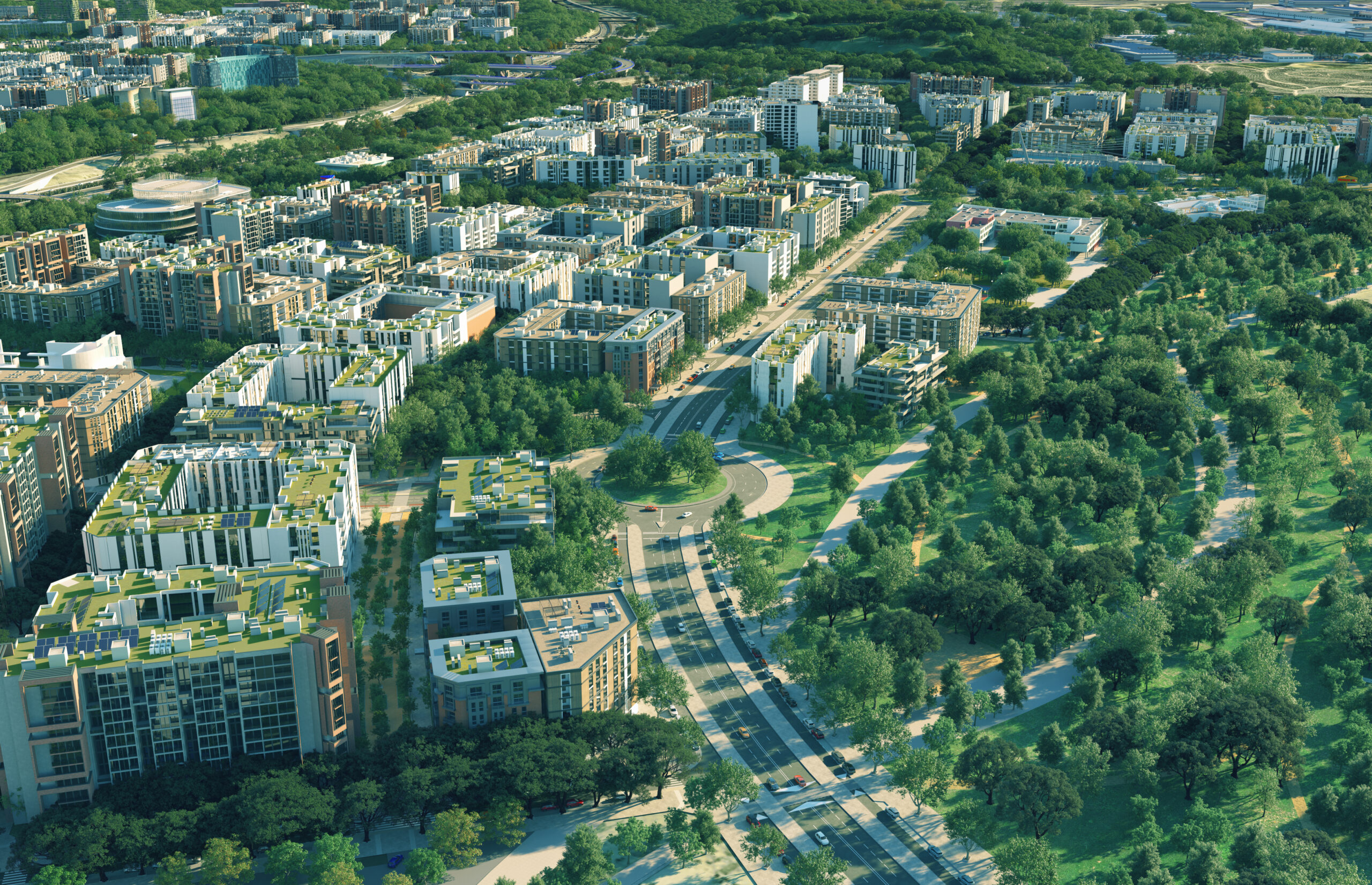 Guía para vivir en Vallecas: zonas recomendadas, transporte y calidad de vida 6 Vallecas Ensanche. Vista aérea de una zona residencial moderna de Vallecas con edificios de pisos de baja altura y techos verdes, intercalados con frondosos parques arbolados y avenidas